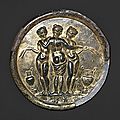 Gilded bronze mirror with the three graces. mid-imperial, antonine, mid-2nd century a.d. 